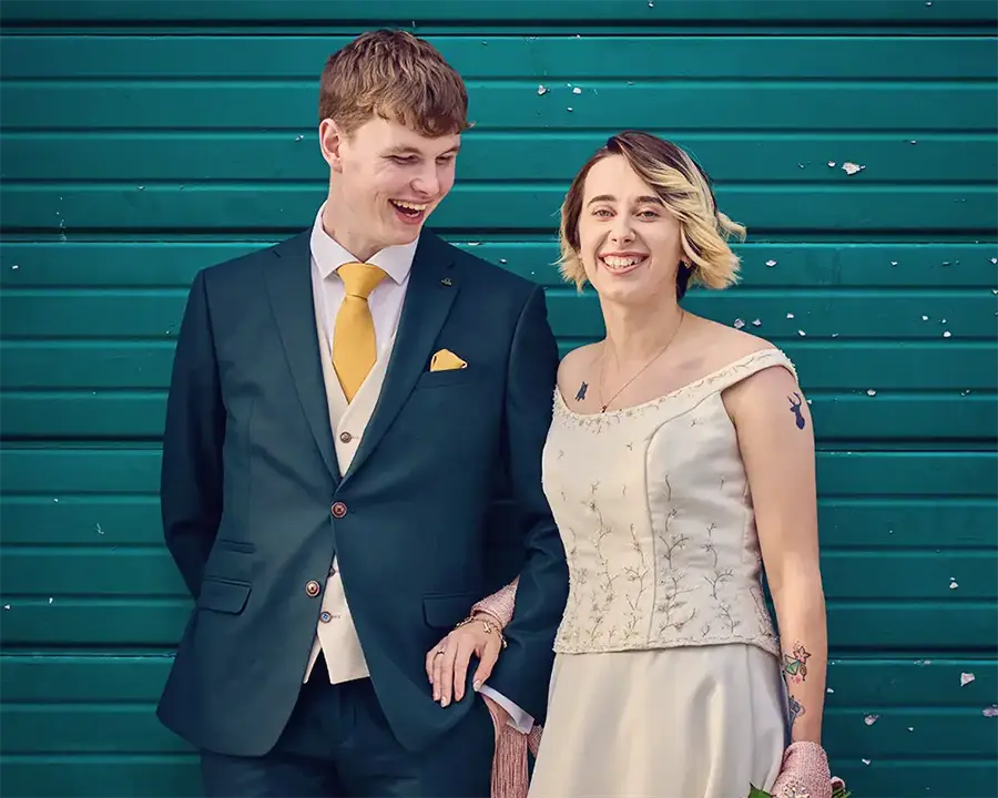 Couple smiling outside registry office ceremony in The Hive, Worcester