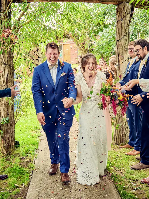 Confetti shower over bride and groom after Worcester wedding ceremony