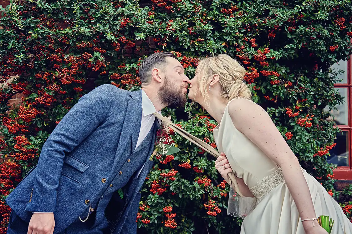 Newlyweds first kiss in the Elgar Room at Malvern Registry Office