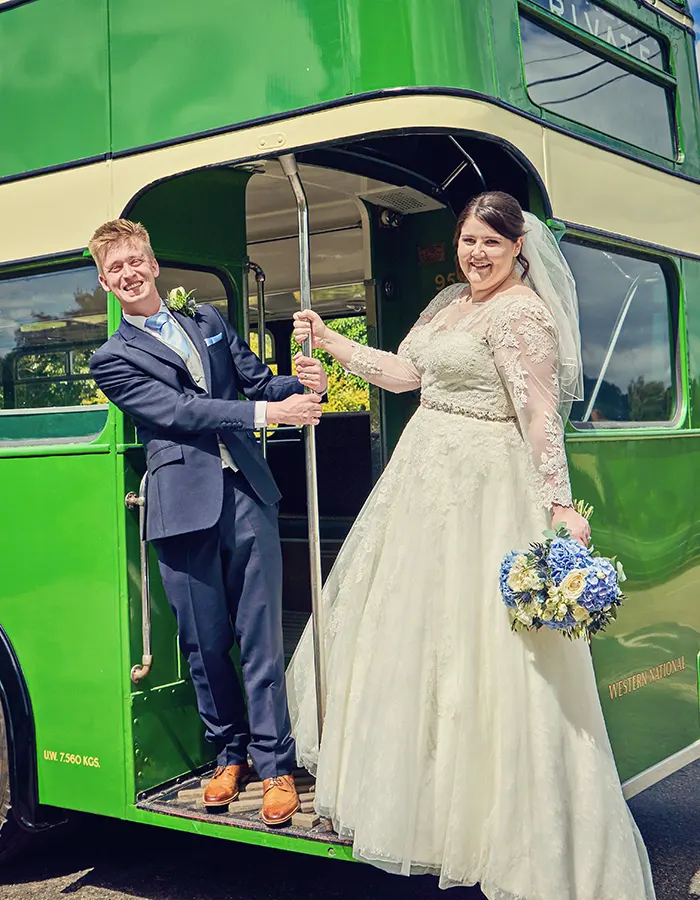 Couple arriving in double decker bus